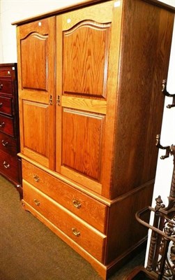 Lot 538 - A gentleman's oak double wardrobe by Royal Oak Company, Grassington