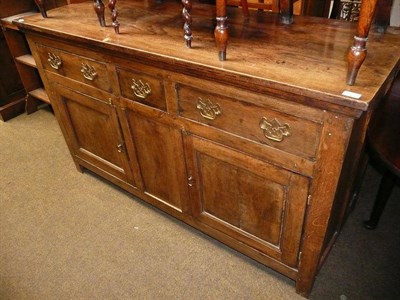 Lot 552 - An 18th century and later oak dresser base