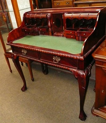 Lot 560 - A reproduction mahogany Chippendale style desk