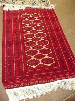 Lot 573 - An Afghan red ground rug