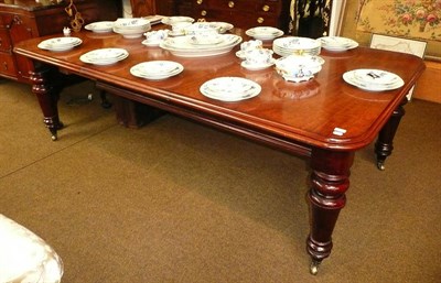 Lot 580 - A Victorian mahogany wind action dining table (with one loose leaf)