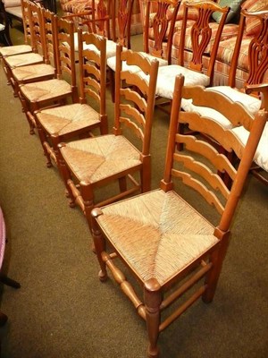 Lot 584 - Seven rush seated chairs