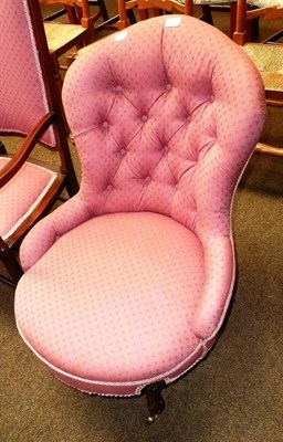 Lot 585 - A Victorian upholstered nursing chair with button back and carved legs