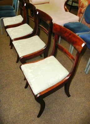 Lot 598 - A set of four Regency mahogany dining chairs with drop in seat and sabre legs