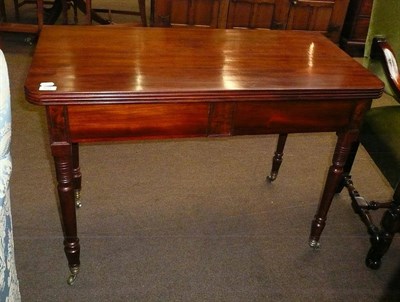 Lot 601 - A Victorian mahogany fold over tea table