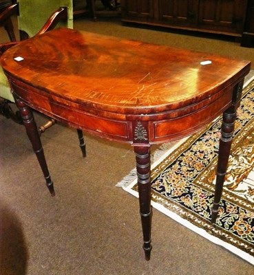 Lot 602 - A 19th century crossbanded mahogany fold over tea table