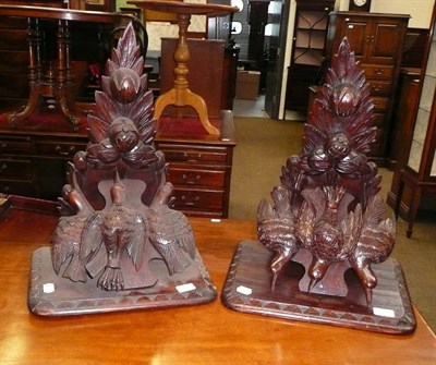 Lot 608 - A pair of carved oak wall brackets