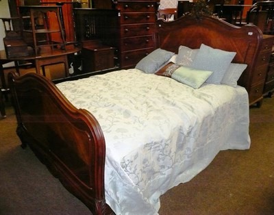 Lot 612 - A 19th century French carved walnut 4ft bed, complete with mattress, feather mattress topper,...