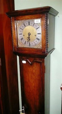 Lot 632 - An early 20th century oak cased grandmother clock, the brass dial with silvered chapter ring,...