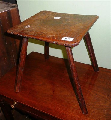 Lot 639 - An oak four legged rustic stool dated 1849