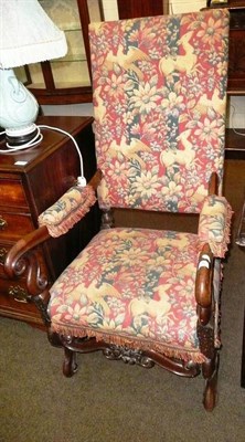 Lot 646 - An 18th century and later carved mahogany open arm elbow chair with red upholstery