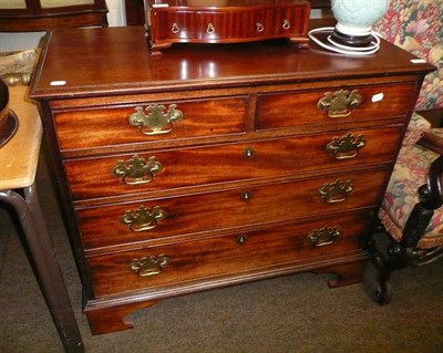 Lot 648 - A Georgian mahogany chest of drawers with later handles