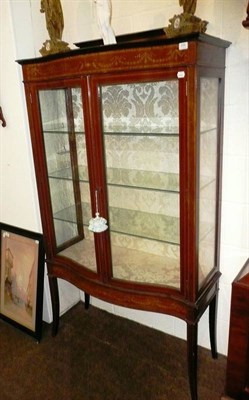 Lot 654 - An Edwardian inlaid mahogany serpentine fronted display cabinet