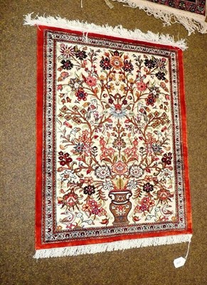 Lot 658 - A small silk Ghom rug