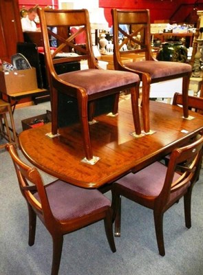 Lot 791 - A modern pedestal extending dining table and six chairs