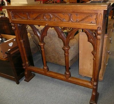 Lot 800 - A carved oak altar and a 20th century oak settle