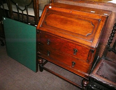 Lot 544A - An oak bureau and a folding card table (2)