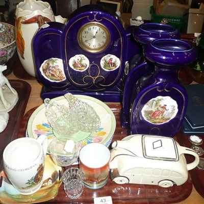 Lot 43 - Pottery clock garniture, car teapot, Clarice Cliff plate and sundry