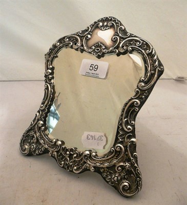 Lot 59 - A silver framed mirror (holed)