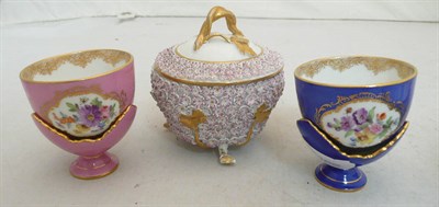 Lot 81 - A Dresden cup and cover in 18th century Meissen style and two Dresden cups and stands