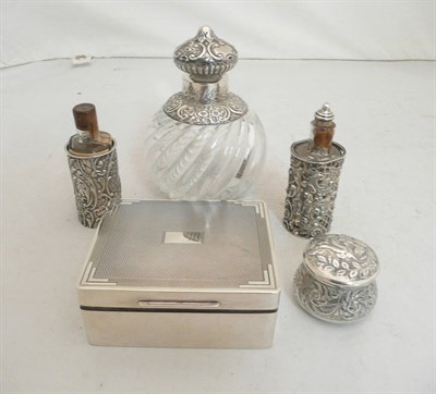 Lot 82 - A silver mounted scent bottle, two smaller scent bottles, a silver box and a cigarette box