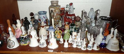 Lot 97 - Two shelves of china, glass bells, Staffordshire and later figures, silver plate, etc