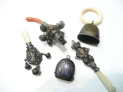 Lot 102 - Three child's silver rattles, a bell and a teething ring