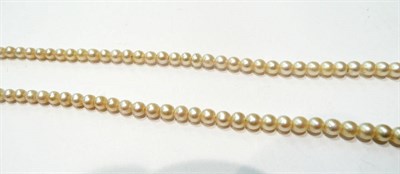 Lot 113 - A strand of pearls with diamond snap