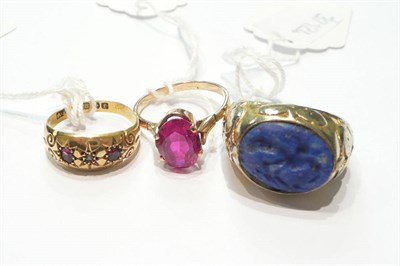 Lot 121 - An 18ct gold diamond and ruby three stone ring, a synthetic ruby ring and a gentleman's ring