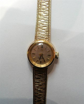 Lot 124 - A lady's 9ct gold Omega wristwatch with bracelet strap