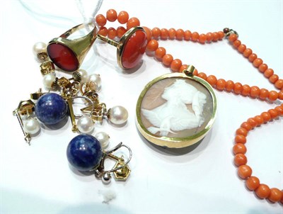 Lot 140 - A cornelian ring, a coral bracelet, a ring, a cameo brooch (a.f.) and a pair of earrings etc