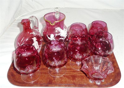 Lot 169 - Two Mary Gregory style jugs, six cranberry flashed brandy glasses and a small dish