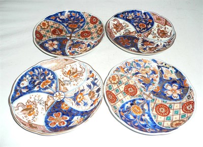 Lot 170 - Four Japanese Imari plates and two wood stands