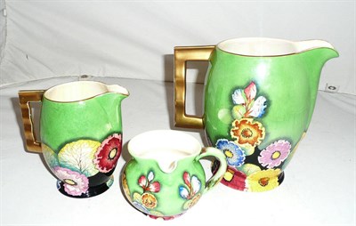 Lot 174 - Three Carlton Ware green Hollyhock jugs