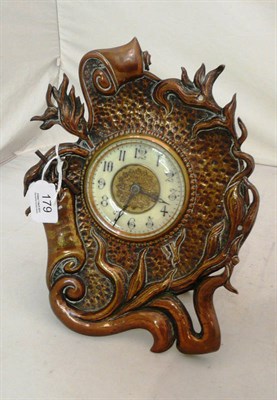 Lot 179 - An Art Nouveau copper framed strut clock