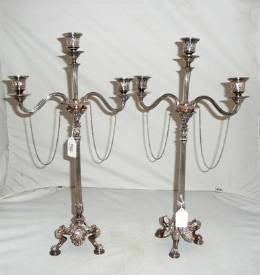 Lot 182 - A pair of plated candelabra