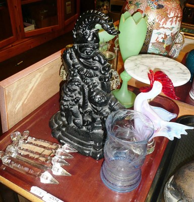 Lot 204 - A tray including a cast iron Mr Punch door stop, green glass table lustre, etc