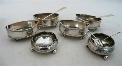 Lot 215 - A pair of silver salts, two Georgian silver mustard spoons and a set of four plated salts etc