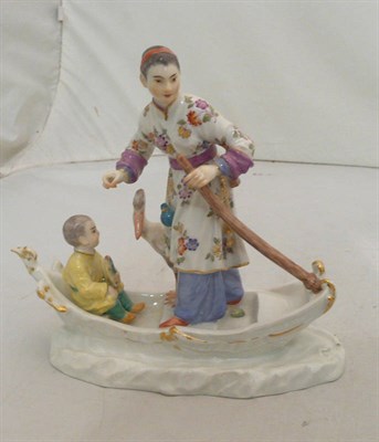 Lot 223 - A Meissen group of a boy and a figure in a boat