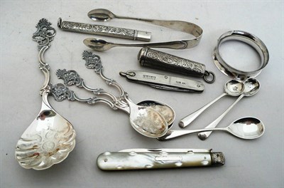 Lot 235 - Two fruit knives, a penknife, four Norwegian spoons, tongs, three salt spoons, a napkin ring...