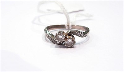 Lot 249 - A diamond two stone twist ring