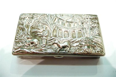 Lot 257 - A silver coloured metal snuff box with repousse cover