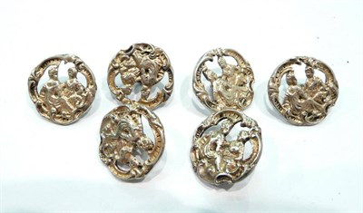 Lot 267 - A set of six silver coloured metal buttons pierced and chased with classical figures