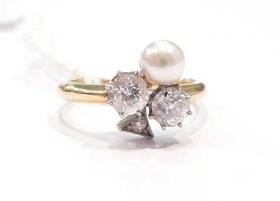 Lot 268 - A three stone diamond and pearl ring