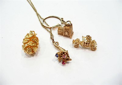 Lot 291 - A pendant on chain and four assorted charms