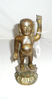 Lot 312 - A small gilt bronze figure of a Buddhistic young boy, probably late Ming/early Qing