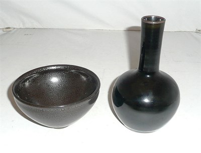 Lot 329 - A Henan style 'oil spot' tea bowl and a famille noir bottle vase