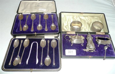 Lot 331 - A cased silver condiment set, two cased sets of six teaspoons and a pair of silver napkin rings