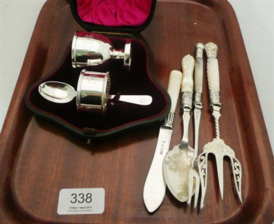 Lot 338 - A cased christening set, a bread fork, a pickle fork, a jam spoon and a butter knife