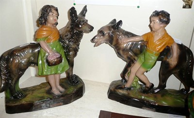 Lot 343 - Good Companions' - two plaster cold painted figures of Alsatians, one with a girl, one with a...